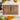 A walnut personalized cutting board engraved with three Christmas trees and the words “The Manuel Family.” Styled with holiday foods—grapes, carrots, cheddar cubes, crackers, and a glass of white wine—this festive board evokes cozy holiday gatherings. A beautiful and practical custom cutting board gift perfect for Christmas entertaining, weddings, or family keepsakes.