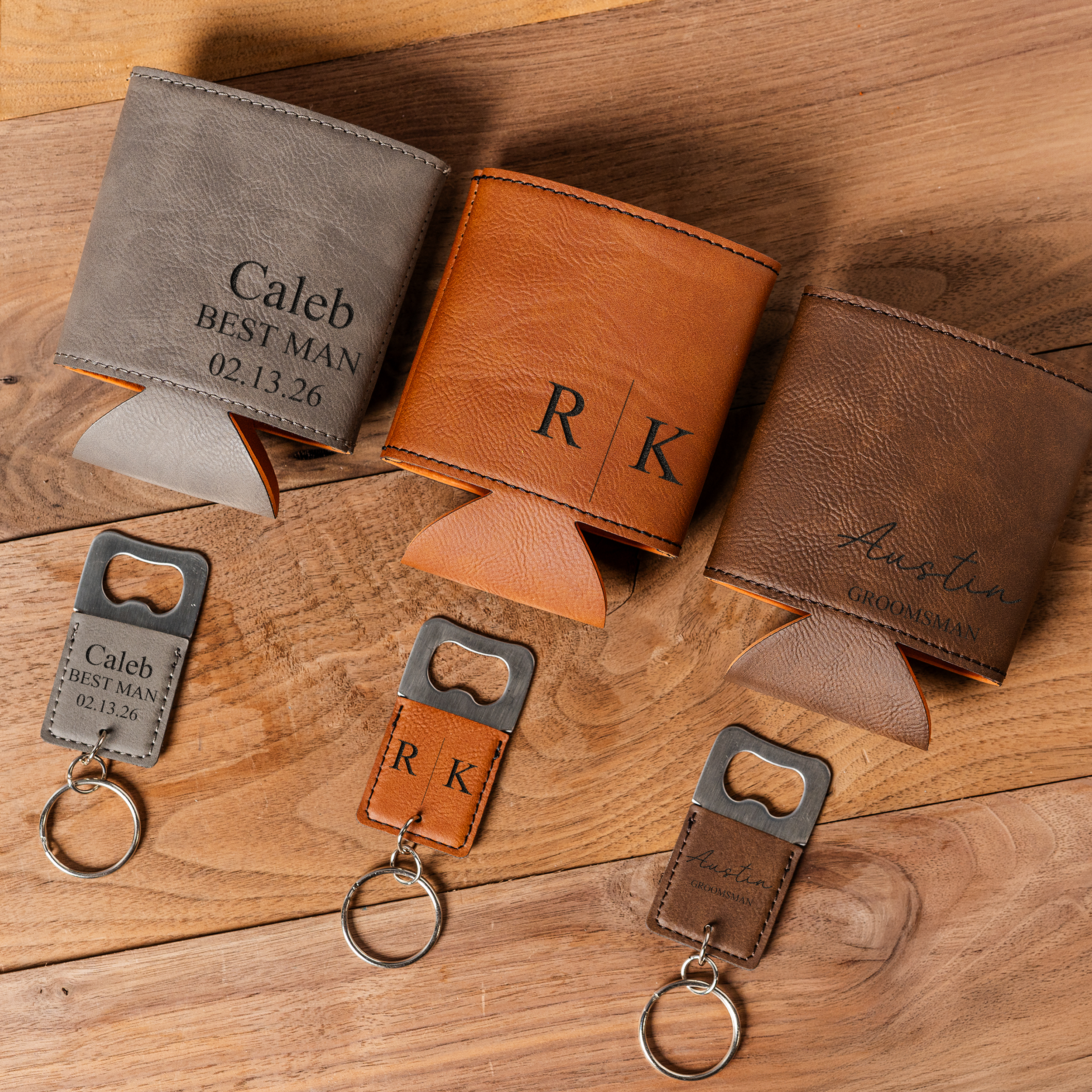 Personalized leather wallets and keychains on a wooden surface