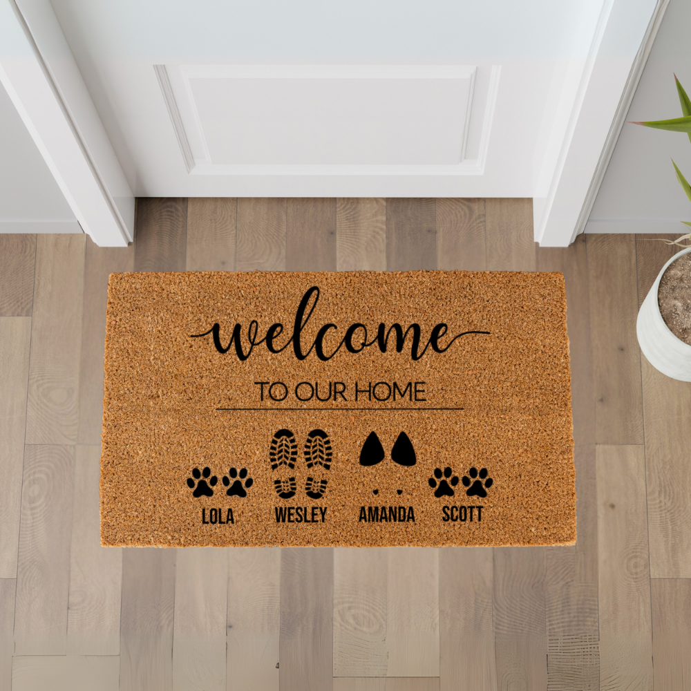 Welcome to our home' text and pet names doormat