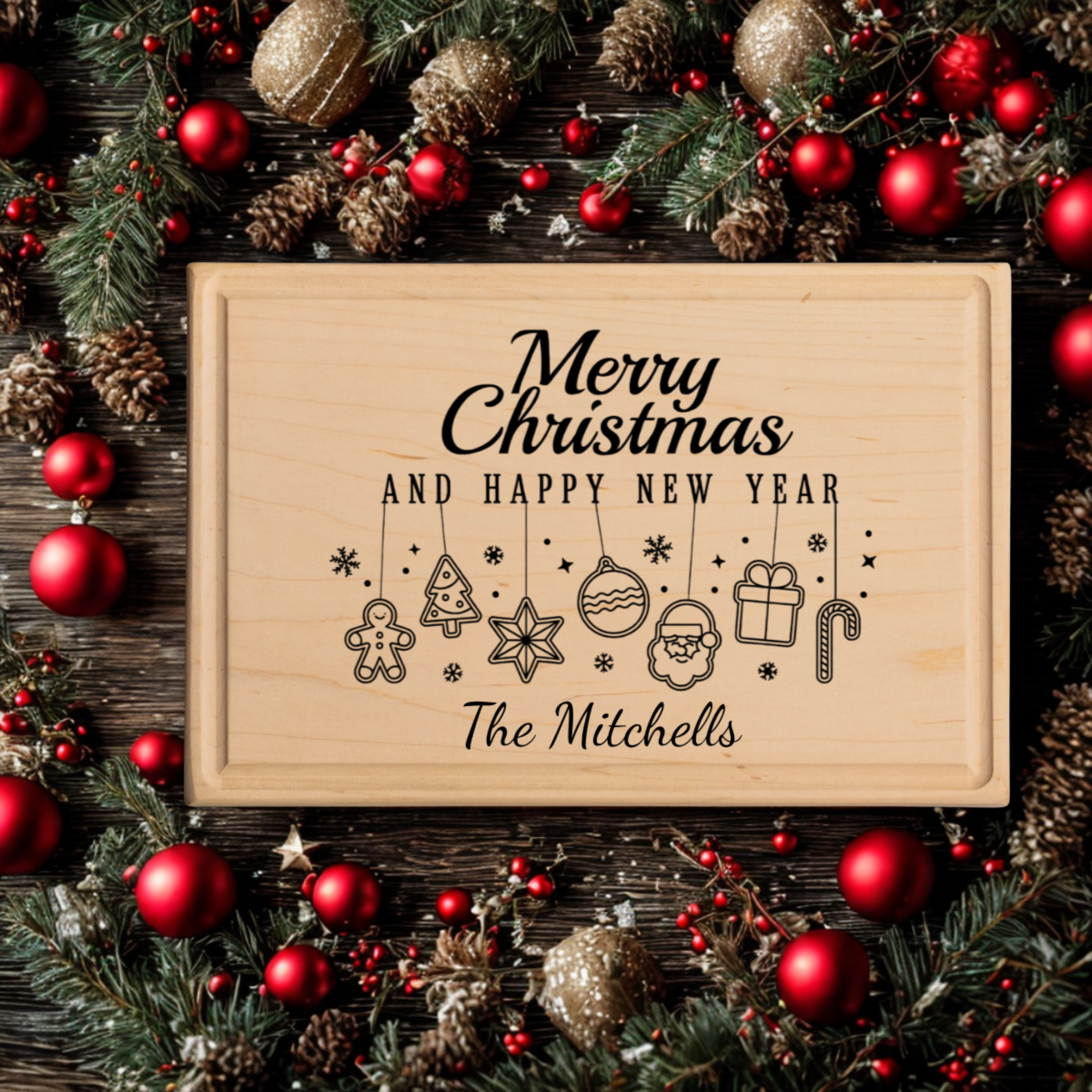 A maple personalized cutting board engraved with “Merry Christmas and Happy New Year” and hanging Christmas icons including trees, stars, ornaments, Santa, and candy canes. The board rests on a rustic wood background surrounded by pine greenery, red and gold ornaments, and holiday berries. This custom cutting board makes a festive and practical cutting board gift for families, newlyweds, and Christmas hosts.